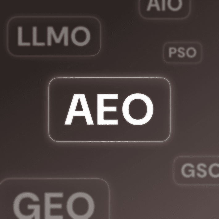 Highlighted acronym 'AEO' at the center of a dark background filled with other blurred AI-related acronyms like GEO, LLMO, and PSO, emphasizing the prominence of Answer Engine Optimization among competing terms.